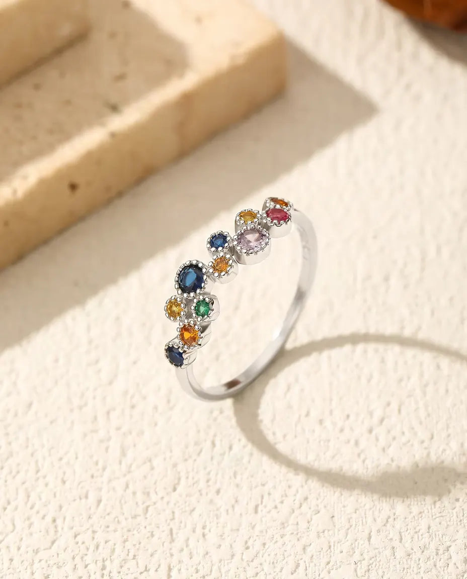 Kleurrijke zirkonia ring - stenen in blauw, geel, groen en roze met milgrain-randen, 925 zilver, maten US 5-9