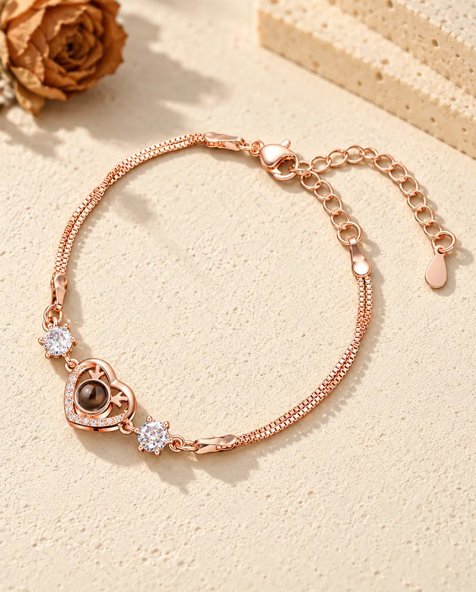 Roségoudkleurige armband met geweihartje, fonkelende zijsteentjes en een dubbele venetiaanse ketting