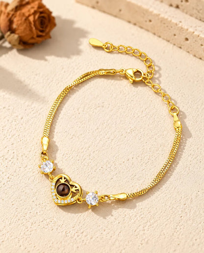 Goudkleurige armband met hartbedel en zirkonia, met karabijnsluiting en verlengketting