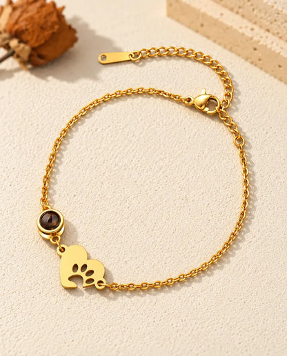 Goudkleurige armband voor huisdierliefhebbers met een hartje met pootafdruk en een verlengketting