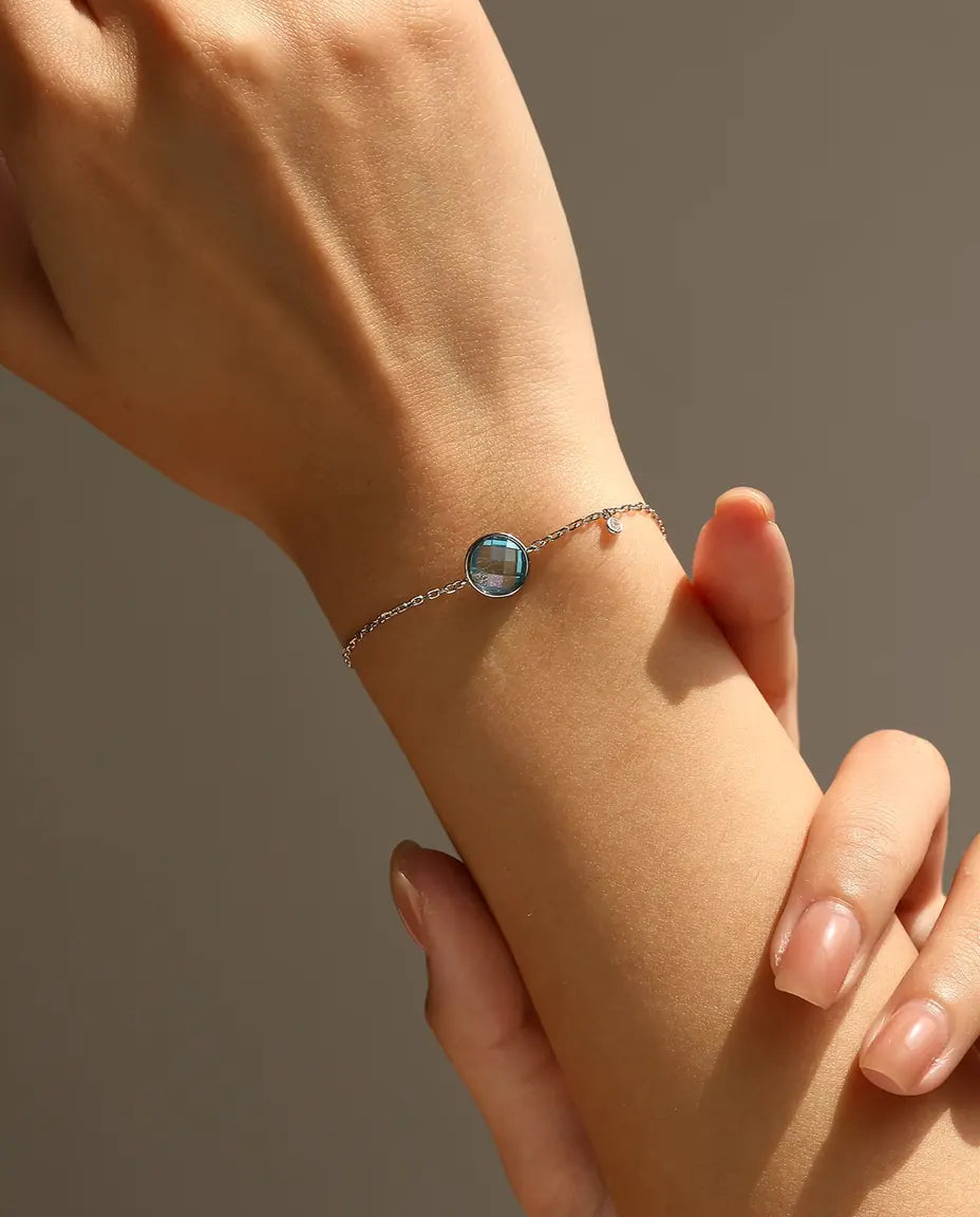 Armband met blauwe zirkonia - 8 mm schaakbordslijpsel aan jasseron met schuifsluiting, 925 sterling zilver